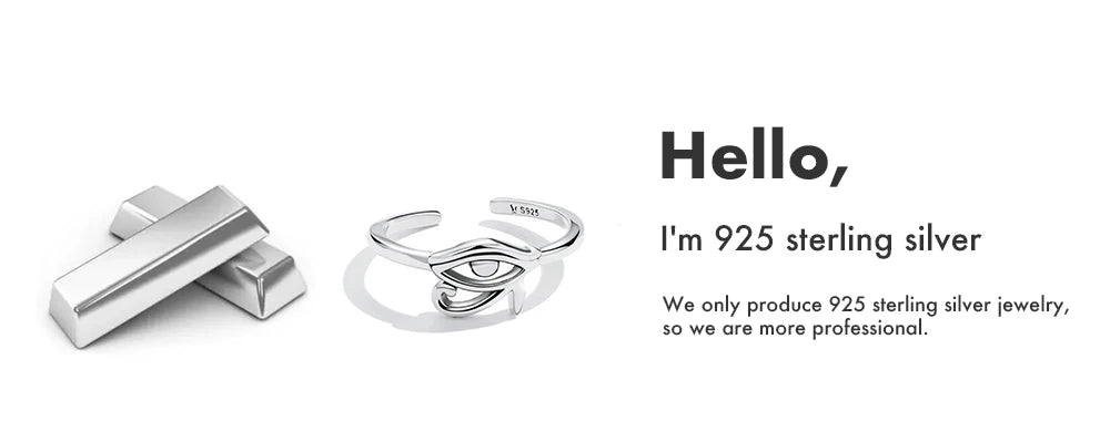 925 sterling silver adjustable evil eye ring beside silver bars