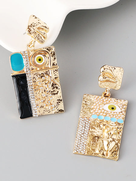 Gold and black earrings with evil eye