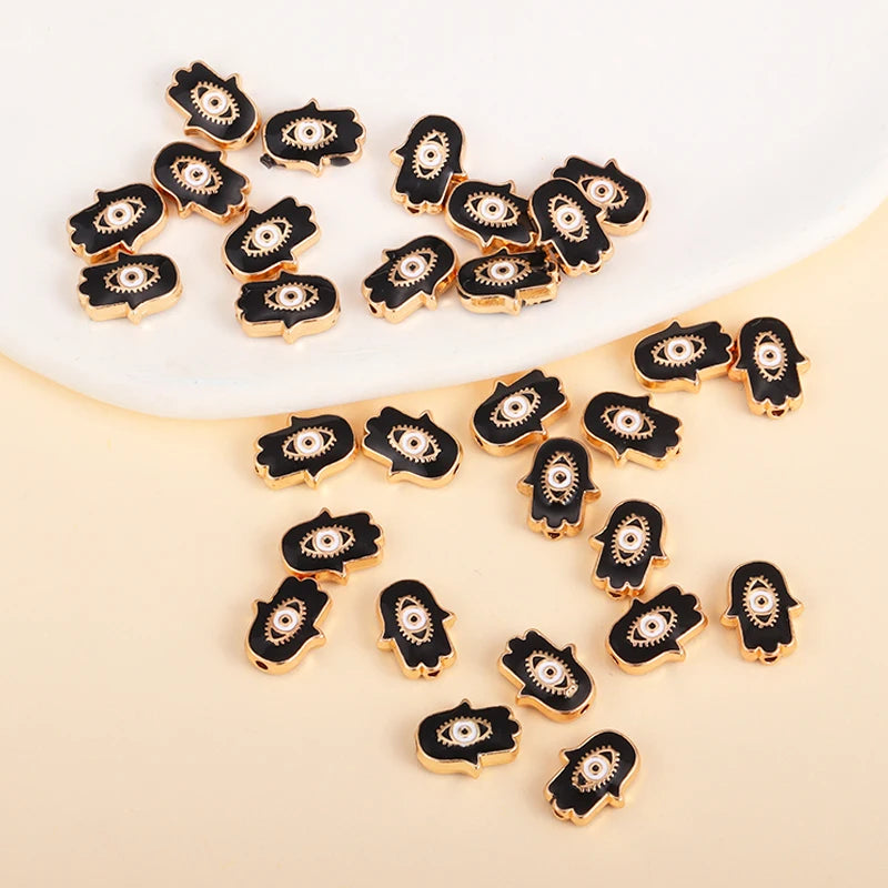 Black Hamsa-shaped evil eye charm beads