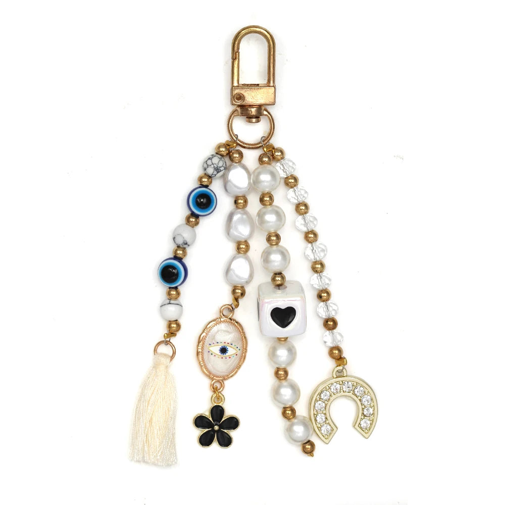 Ward Off Negativity with this Turkish Evil Eye Heart Pendant Tassel Keychain for Good Luck