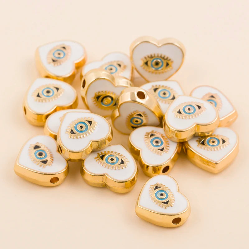 White teardrop-shaped evil eye charm beads