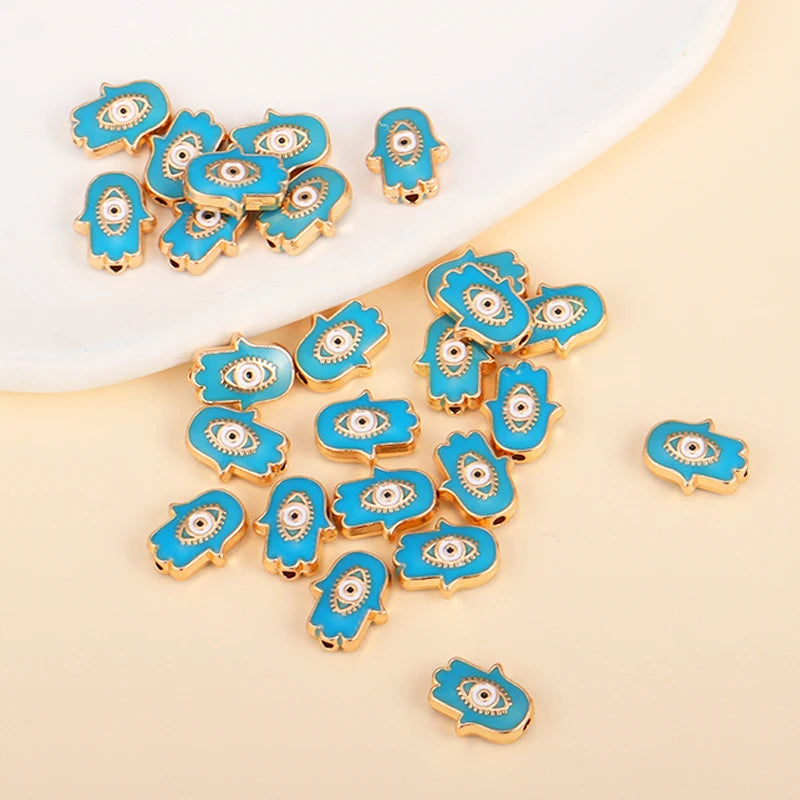 Turquoise Hamsa-shaped evil eye charm beads