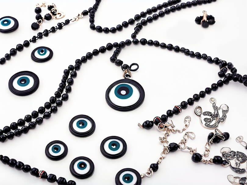 Various Pieces Of Black Evil Eye Jewelry