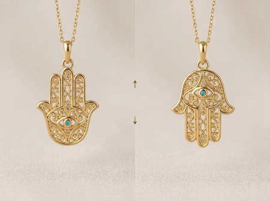 The same gold Hamsa charm shown fingers-up on the left and fingers-down on the right with small up and down arrows