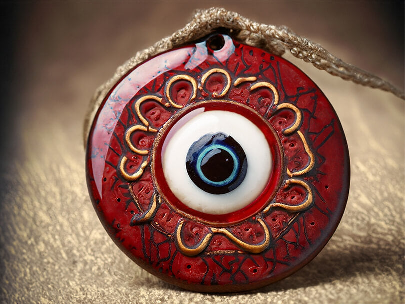An Ancient Maroon Evil Eye Amulet