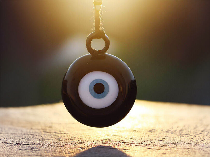 Black Evil Eye Talisman Under Sunlight