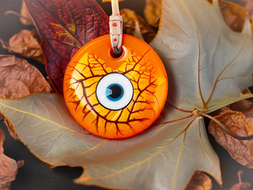 Orange Evil Eye Charm With Autumn Leaves