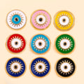 Assorted round evil eye charm bead designs arranged in a grid