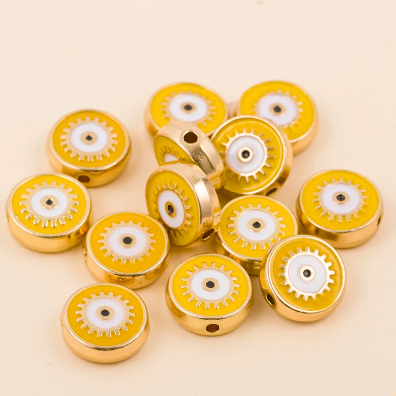 Yellow round evil eye charm beads with gold-tone edges