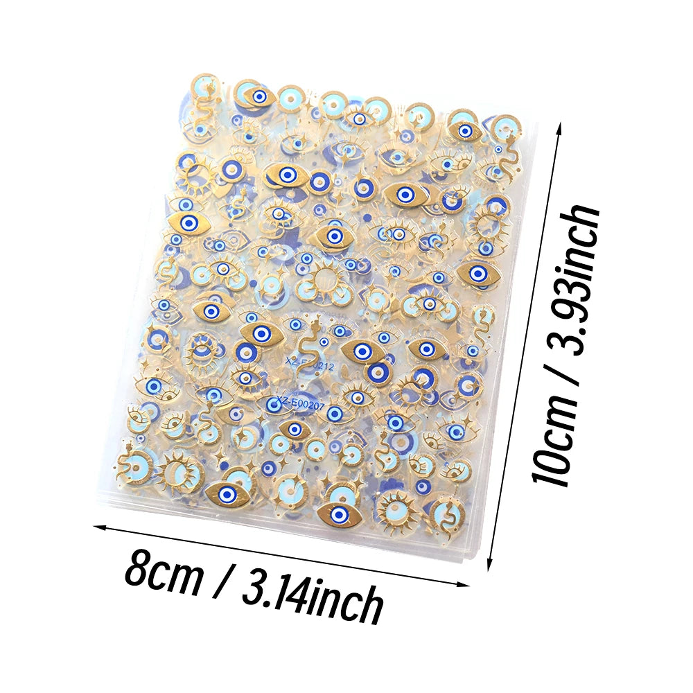10 by 8 centimeter sheet of blue and gold-tone evil eye nail stickers