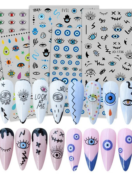 Evil eye nail art sticker designs shown on white and pink manicure samples