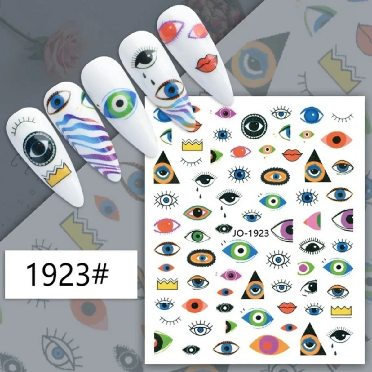 Multicolored abstract eye nail stickers displayed on white manicure samples