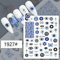 Blue evil eye and butterfly nail stickers displayed on white manicure samples