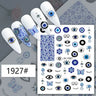 Blue evil eye and butterfly nail stickers displayed on white manicure samples
