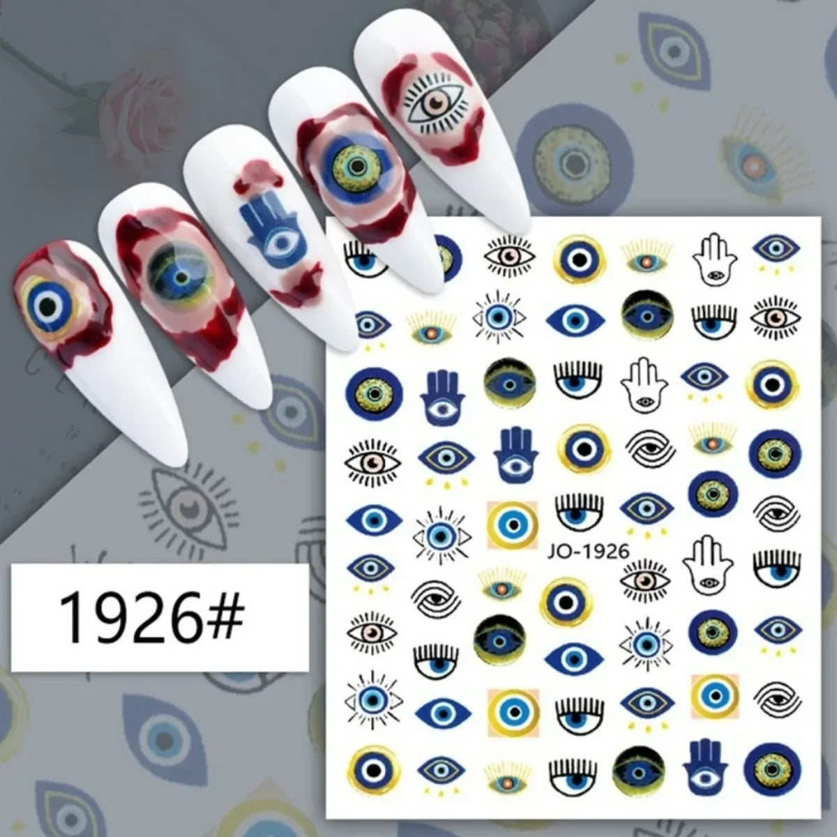 Blue and gold-tone eye and Hamsa nail stickers displayed on white manicure samples