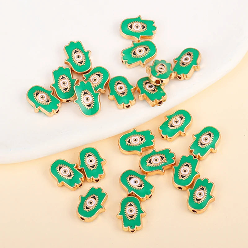 Green Hamsa-shaped evil eye charm beads