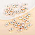 White Hamsa-shaped evil eye charm beads