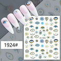 Blue and gold-tone eye motif nail stickers displayed on pink manicure samples