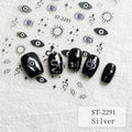 Five black nail art decals or false nail tips with silver and blue evil eye designs are arranged on a white textured background, surrounded by matching small eye, star, and wavy line motifs. Text reads ST-2291 and Silver.