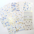 Six sheets of blue and gold-tone evil eye nail stickers with eye, star, moon, snake, and Hamsa motifs