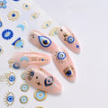 Blue and gold-tone evil eye nail sticker manicure with matching eye and Hamsa decals