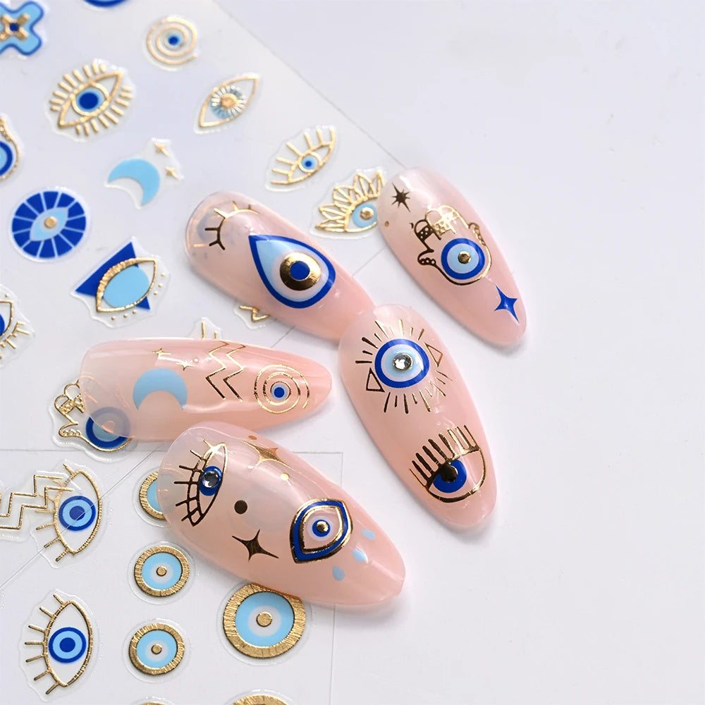 Blue and gold-tone evil eye nail sticker manicure with matching eye and Hamsa decals