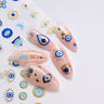Blue and gold-tone evil eye nail sticker manicure with matching eye and Hamsa decals