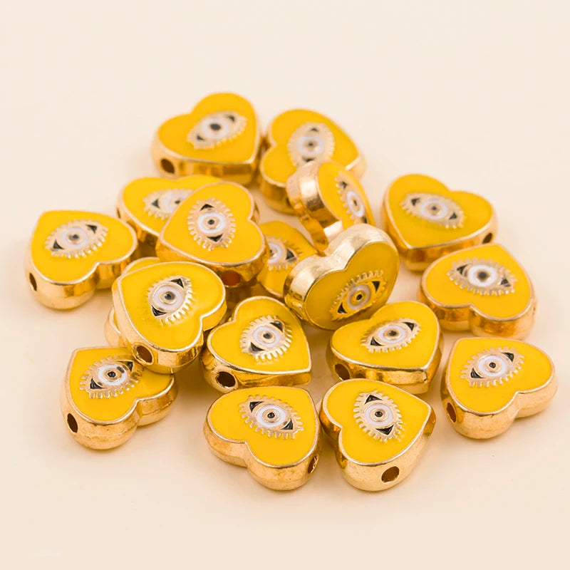 Yellow heart-shaped evil eye charm beads