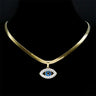 Open Eye necklace in gold tone arranged on a black necklace display, showing the chain and blue-centered pendant