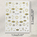 A sheet of decorative stickers featuring gold-toned suns, stars, evil eye motifs, and snake illustrations on a white background, with printed dimensions showing 9.1 cm by 7.