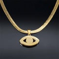 Back of the Open Eye pendant in gold tone, showing its plain reverse and eye-shaped openings beneath the flat chain