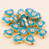 Turquoise teardrop-shaped evil eye charm beads