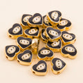 Black teardrop-shaped evil eye charm beads