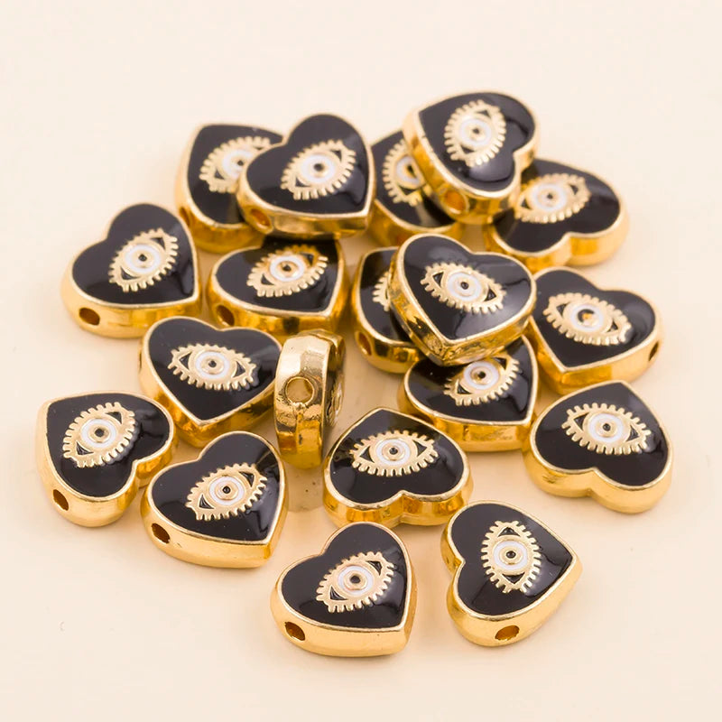 Black teardrop-shaped evil eye charm beads