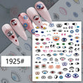 Multicolored illustrated eye nail stickers displayed on pink manicure samples