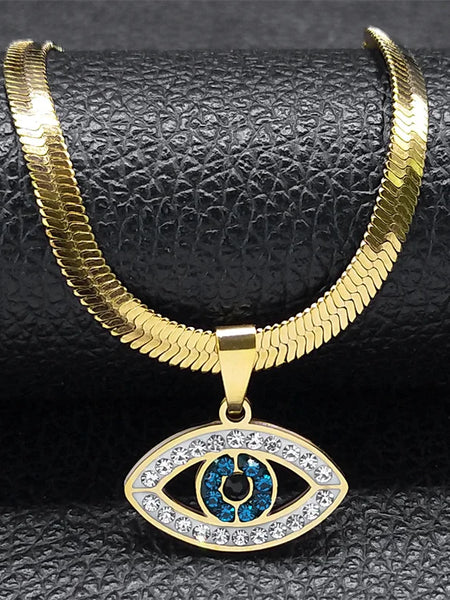 Close-up of the Open Eye necklace in gold tone, with a flat chain, clear eye outline and blue center accents