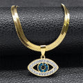 Close-up of the Open Eye necklace in gold tone, with a flat chain, clear eye outline and blue center accents