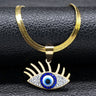 Lash Eye necklace in gold tone with long upper lashes, clear accents and a blue ring around the eye center