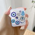 Handheld earphone case with a collage of blue eye pendant illustrations, a beaded strand and EVIL EYES lettering.