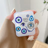 Handheld earphone case with a collage of blue eye pendant illustrations, a beaded strand and EVIL EYES lettering.