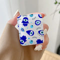 Handheld earphone case with a repeating pattern of blue Hamsa hands, eyes, teardrops and turquoise dots.