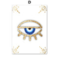 Half-closed blue eye with gold tone lashes and decorative corner flourishes on white