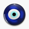 Round deep blue button pin with a white eye ring, turquoise inner ring and black center.