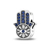 Silver tone Hamsa bead with blue accents along the fingers and petal shapes surrounding an eye in the palm