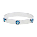 Silver tone evil eye bangle with a smooth band and raised blue eye discs