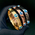 Gold tone, Rose Gold tone and Silver tone smooth bangles with raised round blue eyes