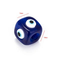 Blue cube evil eye bead with two edges labeled 14mm