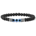 Matte black beaded bracelet with three blue eye beads and reflective chevron spacers