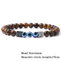 Brown beaded bracelet with three blue eye beads and printed bead-size and bracelet-length annotations