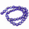 Dark blue flat round evil eye beads with white rings and black centers, arranged in a loop